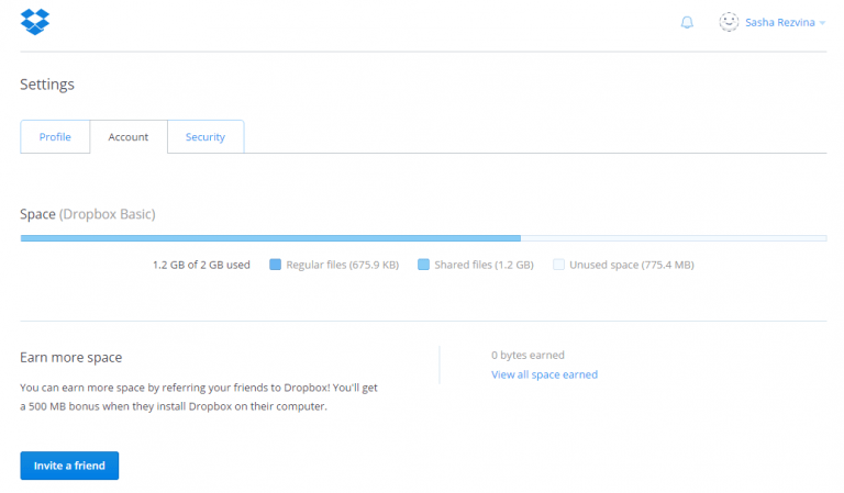 Dropbox account settings page showing storage usage bar. 1.2 GB of 2 GB used, with regular, shared, and unused space breakdown. Below, an 'Earn more space' section explains users can invite friends to Dropbox and receive 500 MB bonus per referral. Blue 'Invite a friend' button at bottom.