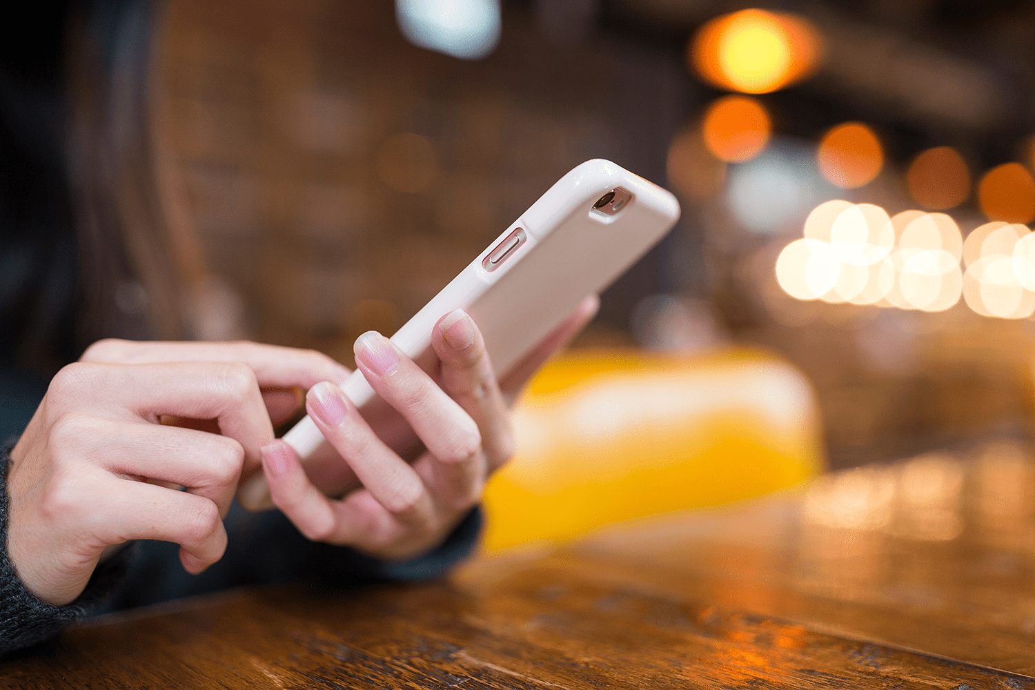 close up shot of woman swiping her phone