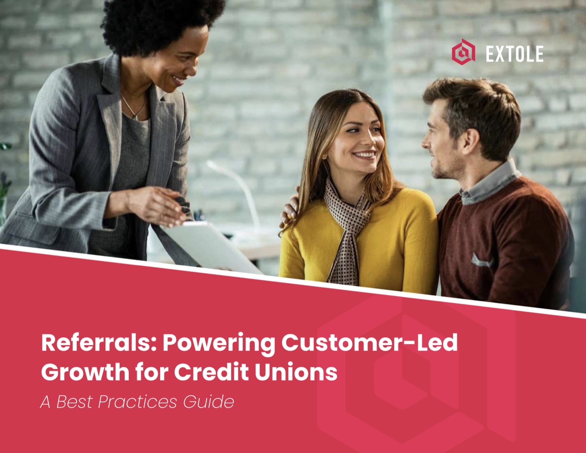 A credit union advisor showing a tablet to a smiling couple on the cover of Extole's referral best practices guide for credit unions